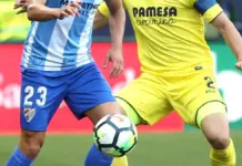 Málaga y Villarreal buscan su primera victoria en una noche de urgencias en La Rosaleda Miguel Torres del Málaga disputa un balón ante Mario Gaspar del Villarreal en La Rosaleda